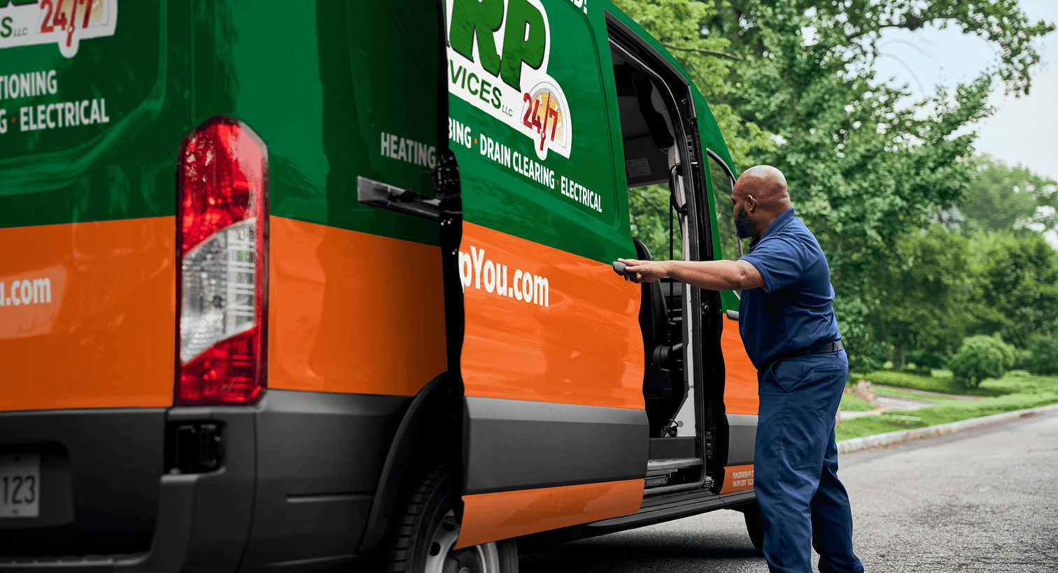 A professional HARP technician opening a service van on a residential street, ready to provide home HVAC, plumbing, and electrical services.
